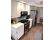 Well-equipped kitchen with stainless steel appliances and tile backsplash at 3628 Nettle Creek Ct, Holiday, FL 34691