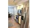 Kitchen featuring stainless steel appliances, bright cabinetry and easy access to the dining room at 3628 Nettle Creek Ct, Holiday, FL 34691