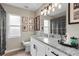 Bathroom featuring granite counters, updated lighting and decorative accents at 4605 Steel Dust Ln, Lutz, FL 33559