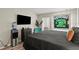 Unique bedroom featuring hardwood floors, eclectic decorations, and a neon sign at 4605 Steel Dust Ln, Lutz, FL 33559