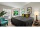 Unique bedroom featuring hardwood floors, eclectic decorations, and a neon sign at 4605 Steel Dust Ln, Lutz, FL 33559