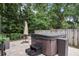 Private backyard patio includes a hot tub for relaxation and entertainment at 4605 Steel Dust Ln, Lutz, FL 33559