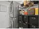 Organized laundry room includes front load washer and dryer and wire shelving at 4605 Steel Dust Ln, Lutz, FL 33559