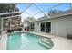 The screened pool offers a relaxing retreat and lots of room for outdoor seating at 4605 Steel Dust Ln, Lutz, FL 33559
