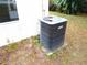 View of an exterior Lennox air conditioning unit against a beige home at 11511 Misty Isle Ln, Riverview, FL 33579