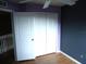 A room with a closet and wood floor at 11511 Misty Isle Ln, Riverview, FL 33579