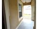 Covered front porch with decorative columns, exterior lighting, and textured stucco walls at 11511 Misty Isle Ln, Riverview, FL 33579
