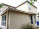 Beige home featuring stucco siding with multiple windows at 11511 Misty Isle Ln, Riverview, FL 33579