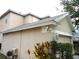 Beige home featuring stucco siding and a garage at 11511 Misty Isle Ln, Riverview, FL 33579
