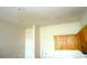 Image of a kitchen with light colored walls and some wood cabinets with recessed lighting at 11511 Misty Isle Ln, Riverview, FL 33579