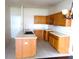 Kitchen featuring cabinets, an island with a sink, and tile flooring at 11511 Misty Isle Ln, Riverview, FL 33579
