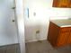 Image of a kitchen area with exposed pipes and wiring in the wall at 11511 Misty Isle Ln, Riverview, FL 33579