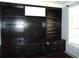 Office space with built-in black bookshelves, cabinets, and a modern design at 11511 Misty Isle Ln, Riverview, FL 33579