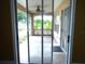 Covered patio with sliding glass doors, perfect for outdoor relaxation and enjoyment at 11511 Misty Isle Ln, Riverview, FL 33579