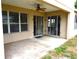 Enclosed back patio with sliding glass doors, offering seamless indoor-outdoor living at 11511 Misty Isle Ln, Riverview, FL 33579