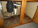 Area under a sink with plumbing and a garbage disposal, showing signs of water damage at 11511 Misty Isle Ln, Riverview, FL 33579