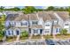 A tranquil community featuring well-maintained townhomes and lush greenery at 10429 Heron Lake Dr, Riverview, FL 33578