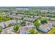 Overhead view of community with pond, lush landscaping, and pool at 10429 Heron Lake Dr, Riverview, FL 33578