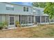 The backyard features a screened in porch and a patio area at 10429 Heron Lake Dr, Riverview, FL 33578