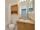 Functional bathroom features a shower, toilet, vanity, and mirror at 10429 Heron Lake Dr, Riverview, FL 33578