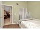 Bedroom showing a view through an open door of another room at 10429 Heron Lake Dr, Riverview, FL 33578