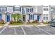 Attractive townhomes with blue shutters and vibrant landscaping enhancing curb appeal at 10429 Heron Lake Dr, Riverview, FL 33578