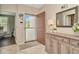 Welcoming foyer with a console table, decorative mirror, and tile flooring at 10429 Heron Lake Dr, Riverview, FL 33578