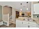 Open kitchen with stainless steel sink and modern white cabinetry at 10429 Heron Lake Dr, Riverview, FL 33578