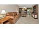 Inviting living room with comfortable leather sofa and stylish furnishings at 10429 Heron Lake Dr, Riverview, FL 33578