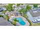 Aerial view of the community pool, clubhouse, and surrounding residences at 10429 Heron Lake Dr, Riverview, FL 33578