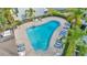 Aerial view of community pool with ample seating and lush landscaping at 10429 Heron Lake Dr, Riverview, FL 33578