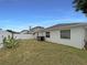 Spacious backyard featuring a privacy fence, mature plants and green grass at 11114 Shadybrook Dr, Tampa, FL 33625