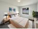 Comfortable main bedroom with a neutral palette, large window, and soft carpet at 11114 Shadybrook Dr, Tampa, FL 33625