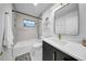 Modern bathroom features a shower-over-tub with marble tile and a sleek vanity at 307 N Glen Ave, Tampa, FL 33609