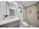 Bathroom featuring a modern vanity, tiled shower, and contemporary fixtures at 307 N Glen Ave, Tampa, FL 33609