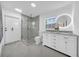 Bathroom features modern tile shower, glass door, double sink vanity, and contemporary lighting at 307 N Glen Ave, Tampa, FL 33609
