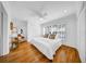 Bright bedroom with hardwood floors, ceiling fan, and cozy reading nook at 307 N Glen Ave, Tampa, FL 33609