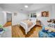 Comfortable bedroom with hardwood floors, a ceiling fan, and closet space at 307 N Glen Ave, Tampa, FL 33609