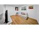 Bedroom featuring hardwood floors, double closets, and comfortable seating area at 307 N Glen Ave, Tampa, FL 33609