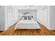 Bedroom with hardwood floors, natural lighting, and large closets at 307 N Glen Ave, Tampa, FL 33609