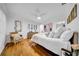 Bedroom features a ceiling fan, hardwood floors, and a comfortable sitting area at 307 N Glen Ave, Tampa, FL 33609