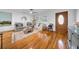 Bright living room with hardwood floors, large windows, and stylish neutral furniture at 307 N Glen Ave, Tampa, FL 33609