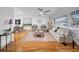 Open living space with hardwood flooring, natural light, and comfortable seating area at 307 N Glen Ave, Tampa, FL 33609