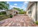Spacious brick patio with covered area perfect for outdoor entertaining at 307 N Glen Ave, Tampa, FL 33609