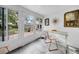 Bright sun room with tiled floor and backyard access at 307 N Glen Ave, Tampa, FL 33609