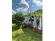 Grassy lawn surrounding the house, complemented by landscaped features and trees, adds natural beauty and curb appeal to the home at 5258 Wisteria Cir, New Port Richey, FL 34653