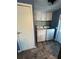 Neat laundry room features modern appliances, updated cabinets, and fresh decor at 5258 Wisteria Cir, New Port Richey, FL 34653