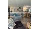 Open-concept living space with stylish decor, and laminate wood flooring throughout at 5258 Wisteria Cir, New Port Richey, FL 34653