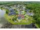 Aerial showcasing a beautiful neighborhood, pond and manicured yards at 27740 Water Ash Dr, Wesley Chapel, FL 33544