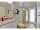 Modern bathroom features a glass-enclosed shower and stylish vanity with a granite countertop at 27740 Water Ash Dr, Wesley Chapel, FL 33544